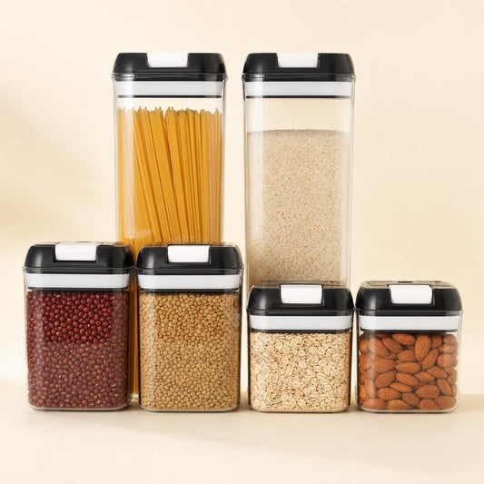 Set de 6 contenedores transparentes con tapa negra, llenos de pasta, arroz, fríjoles, lentejas, avena y almendras